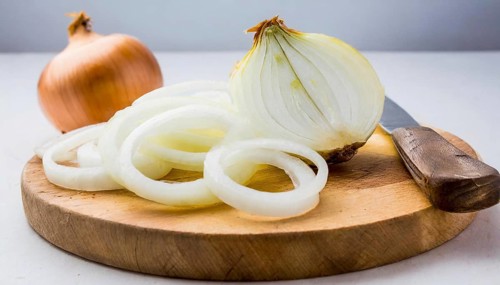 Vegetables, onion, Allium cepa, freshly cut onion rings on a wooden board, Studio