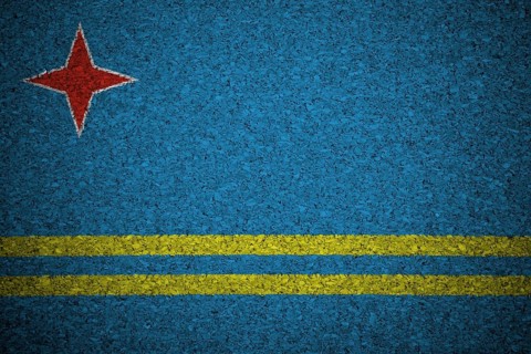 The Aruba Flag painted on a cork board