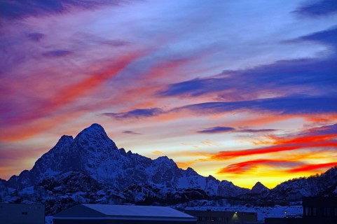 Colourful sunset behind snow-covered mountains, winter, Svolvaer, Lofoten, Nordland, Norway, Europe
