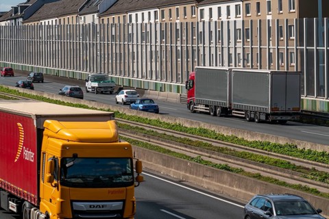 The A40 motorway, Ruhrschnellweg, in Essen, residential buildings directly on the motorway, glass