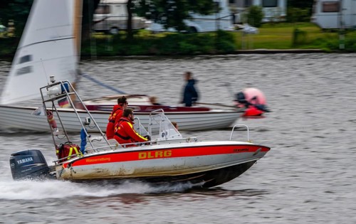 Lake Baldeney, sailing boat, DLRG rescue boat on an alarm trip, Essen, North Rhine-Westphalia,