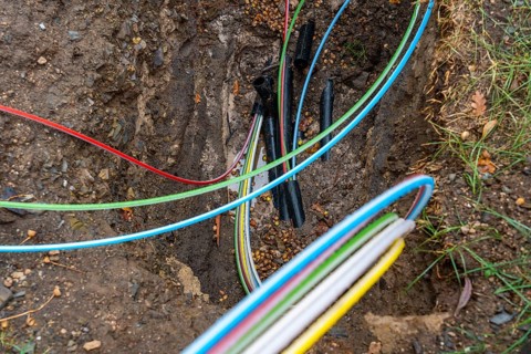 Laying of fibre optic cables, construction site, excavation pit, connection for fast Internet, near