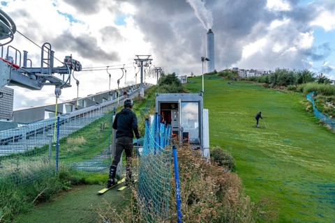 CopenHill, waste incineration plant and artificial ski slope, skiing with a view of the Oresund,