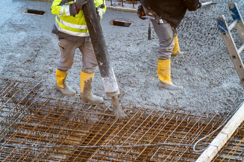 Construction site, concreting, floor, ceiling for a building is concreted, the concrete is pumped