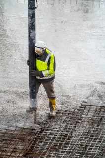 Construction site, concreting, floor, ceiling for a building is concreted, the concrete is pumped