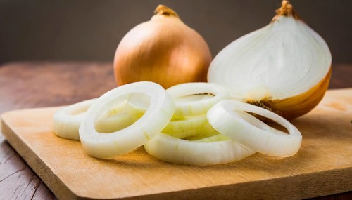 Vegetables, onion, Allium cepa, freshly cut onion rings on a wooden board, Studio