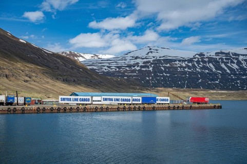 Cargo shipping container at the port harbor of Seydisfjordur, Iceland, view from the distance with
