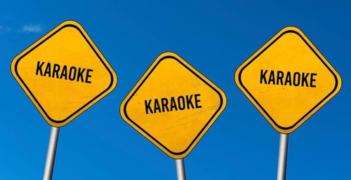 Karaoke, yellow signs with blue sky