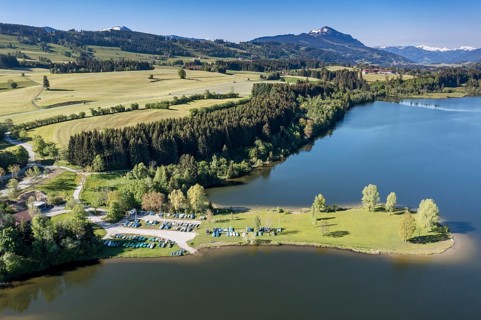 Aerial view over lake Rottachsee towards mountain Grünten, Allgäu, Bavaria, Germany, Europe