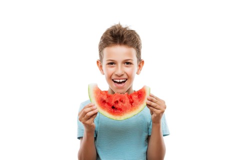 Handsome smiling child boy hand holding red ripe watermelon fruit food slice white isolated