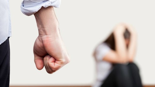 Family violence and aggression concept, furious angry man raised punishment fist over scared or
