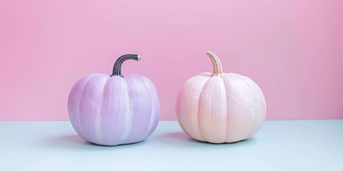 Pastel violet and cream colored pumpkins in front of blue and pink background. Generative Ai, AI