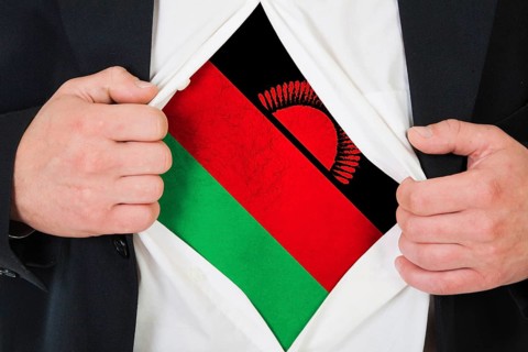 The Malawi flag painted on the chest of a man