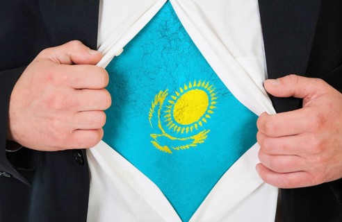 The Kazakh flag painted on the chest of a man