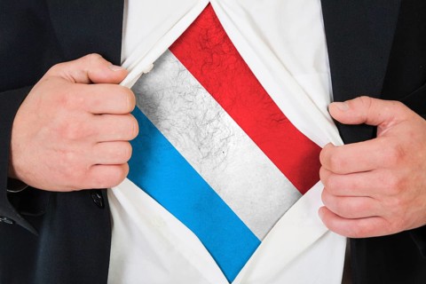 The Luxembourg flag painted on the chest of a man