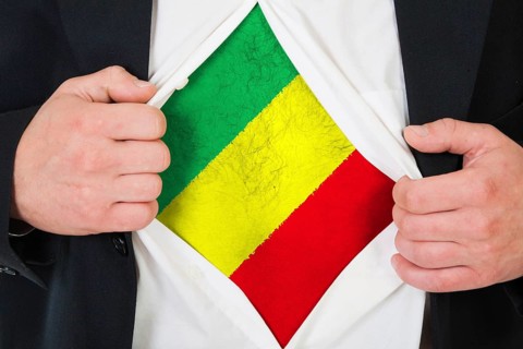The Malian flag painted on the chest of a man
