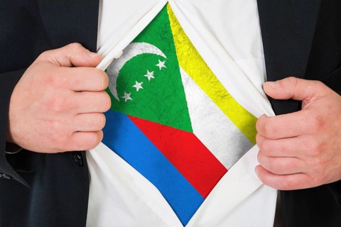 The Comoros flag painted on the chest of a man