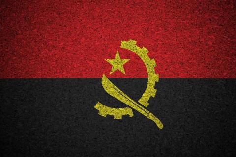 The Angolan flag painted on a cork board