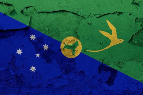 Christmas Island flag painted on the cracked grunge concrete wall