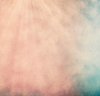 Pastel colored bokeh background with defocused round lights and sunbeams, flare overlay