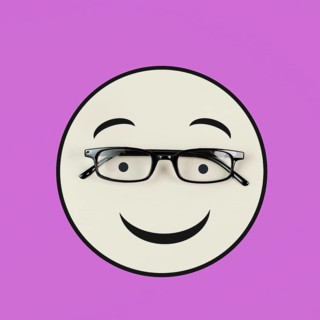 Head with a smiling face and eyeglasses, mental health concept, positive mindset, support and