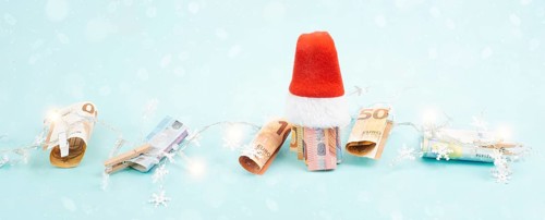 Christmas fairy lights with money, increase of electricity costs, save energy at the holiday season