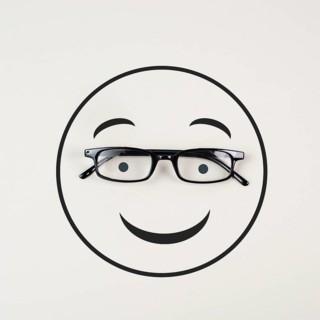 Head with a smiling face and eyeglasses, mental health concept, positive mindset, support and