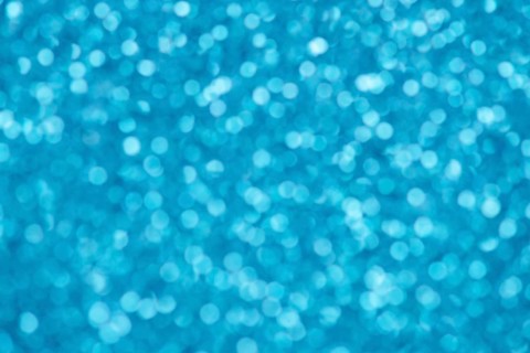 Blue bokeh background for christmas, defocused round lights and sunbeams, flare overlay