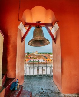 Bell tower of the La Merced church with a view of the cathedral in Granada, Nicaragua, Central