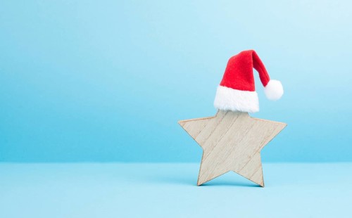 Star with a red christmas hat, winter greeting card and banner, copy space
