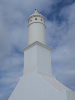 Lighthouse with a tower-shaped building under a cloudy sky in Lanzarote, arrecife, Lanzarote,
