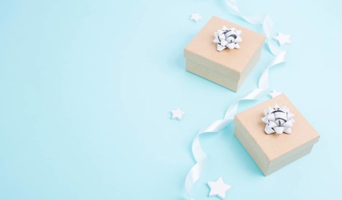 Christmas holiday greeting card with little gift boxes, stars and fir branches, blue background