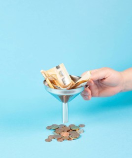 Inflation and financial crash, euro banknotes in a funnel become coins, economic development and