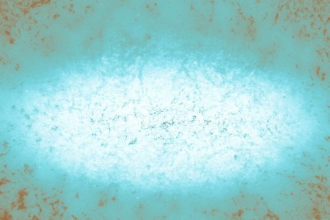 A grunge-style abstract background with blue and rust textures, evoking a worn and distressed feel,