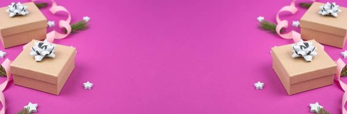 Christmas holiday background with little gift boxes, stars and fir branches, pink trendy background