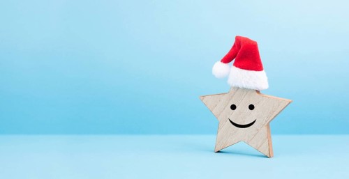 Star with a happy smiling face expression, red christmas hat, winter greeting card and banner, copy