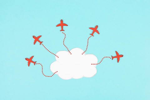 Red airplanes flying out of a cloud, brainstorming for ideas in a team, startup in business, having