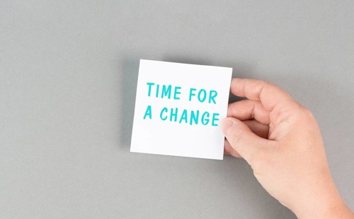 The phrase time for a change is standing on the paper, starting a new business or education goal,