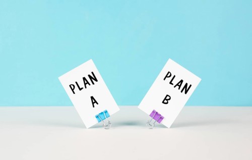 Plan A and B standing on paper, brainstorming for possibilities, making a decision