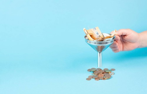 Inflation and financial crash, euro banknotes in a funnel become coins, economic development and