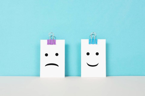 Head with a sad and a happy face, mental health concept, positive and negative mindset, depression,