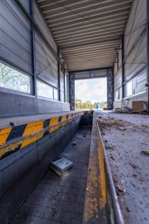 Abandoned hall or workshop with metal structures and side light, demolition site, Saarbrücken,