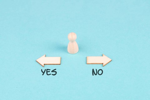 Men stands in front of two arrow with the words yes and no, making a decision, asking questions,