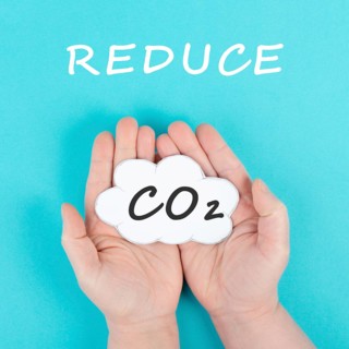 Hand holds cloud with the word CO 2, reduce carbon dioxide emission, environmental issue, air