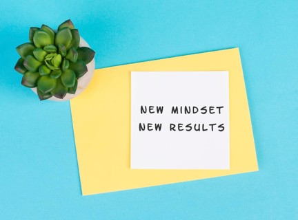 New mindset new results is standing on a paper, coaching strategy, optimistic and positive