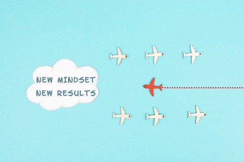Red airplane is flying to the cloud with the words new mindset new results, changing lifestyle,