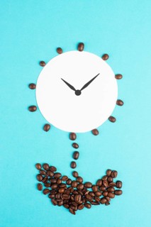 Alarm clock flower made from coffee beans, wake up in the morning, having a deadline, time for a