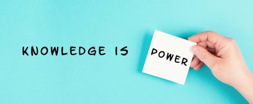 The phrase knowledge is power is standing on a paper, coaching and education concept, development