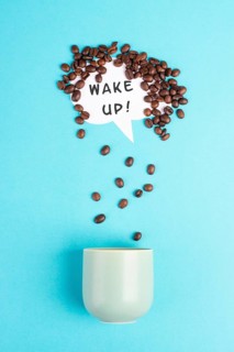 Cloud with roasted coffee beans raining into a cup, take a break, having an espresso for breakfast
