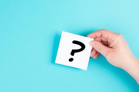 Question mark in the hand, looking for an answer, searching for knowledge, problem solving,